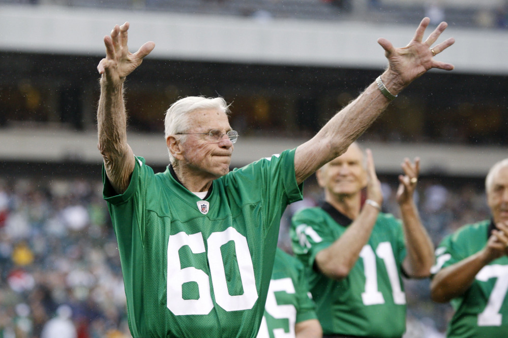 Former Philadelphia Eagles football player Chuck Bednarik wears his number 60 jersey as he participates in a ceremony commemorating the 1960 championship in Philadelphia in 2010.