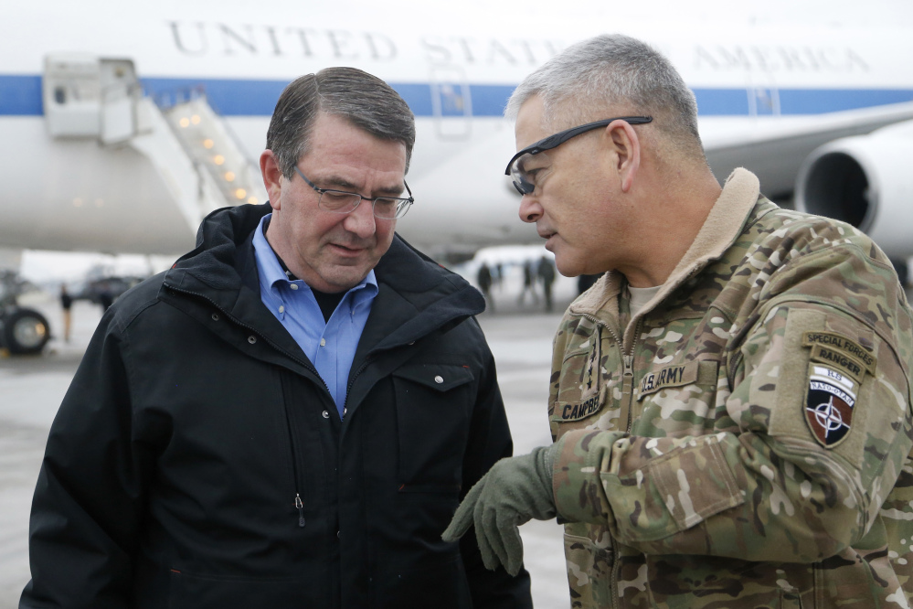 U.S. Secretary of Defense Ash Carter, left, walks with U.S. Army Gen. John Campbell upon arrival at Hamid Karzai International Airport in Kabul, Afghanistan, in February.
