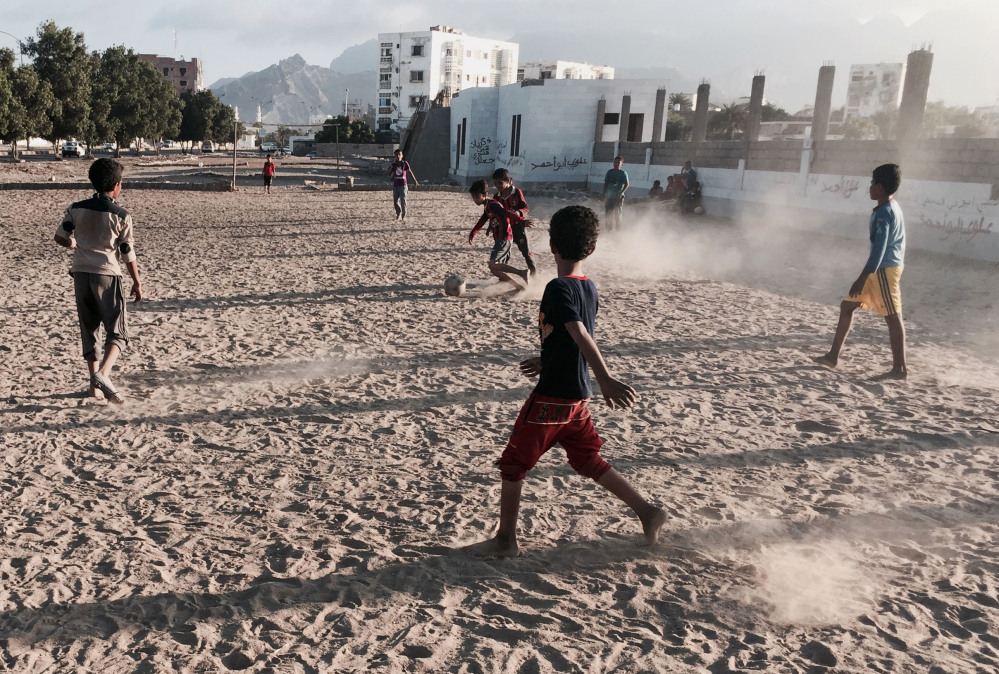 In this photo taken Saturday, children play soccer in an open field in Aden, Yemen. The city is visibly expecting assault, whether from the forces of Hadi’s rival, ousted President Ali Abdullah Saleh, who has allied himself with the Shite rebels, or from al-Qaida militants.