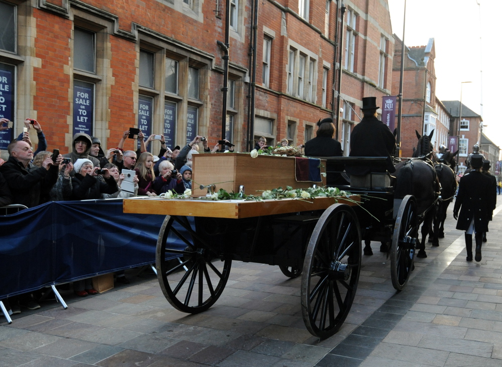 The coffin containing the remains of King Richard III of Shakespeare fame is carried by gun carriage on Sunday through Leicester, England. The crowd included some in period costume and armor, and re-enactors fired cannons at the battlefield where the king died.