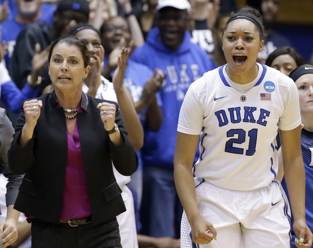 Duke Coach Joanne P. McCallie and Kendall Cooper celebrate Sunday near the end of the Blue Devils’ 64-56 victory over Mississippi State in Durham, N.C. on March 22, 2015.