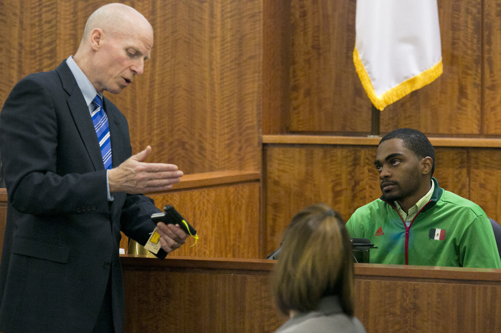 Prosecutor William McCauley questions Gion Jackson, who purchased the pistol recovered near the crime scene, during the murder trial of former NFL football player Aaron Hernandez in Bristol County Superior Court on Monday in Fall River, Mass.
