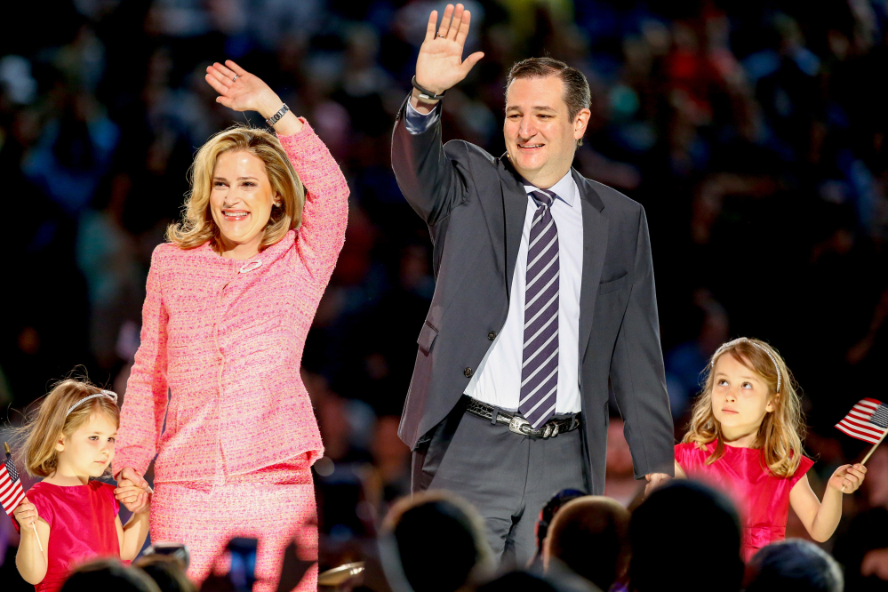 Sen. Ted Cruz, R-Texas, his wife, Heidi, and their two daughters Catherine, 4, left, and Caroline, 6, right, wave on stage after he announced his campaign for president Monday at Liberty University in Lynchburg, Va. Cruz, the first major declared candidate in the 2016 race for president, has said he wants to be seen as the “disruptive app” of Republican politics.