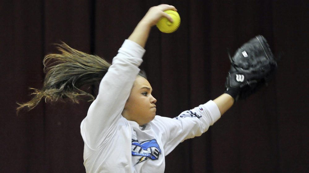 Bailey Tremblay, a Thornton Academy senior, winds up for a pitch on the first day of practice for Maine high school pitchers and catchers. Tremblay led the Golden Trojans to their first Western Class A championship last year and is regarded as one of the state’s top softball pitchers.