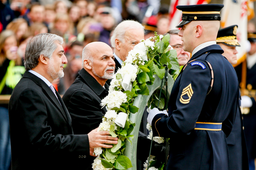 Afghanistan’s Chief Executive Officer Abdullah Abdullah, left, and Afghanistan’s President Ashraf Ghani, second from left, participate in a wreath-laying ceremony at the Tomb of the Unknowns on Tuesday at Arlington National Cemetery in Arlington, Va.