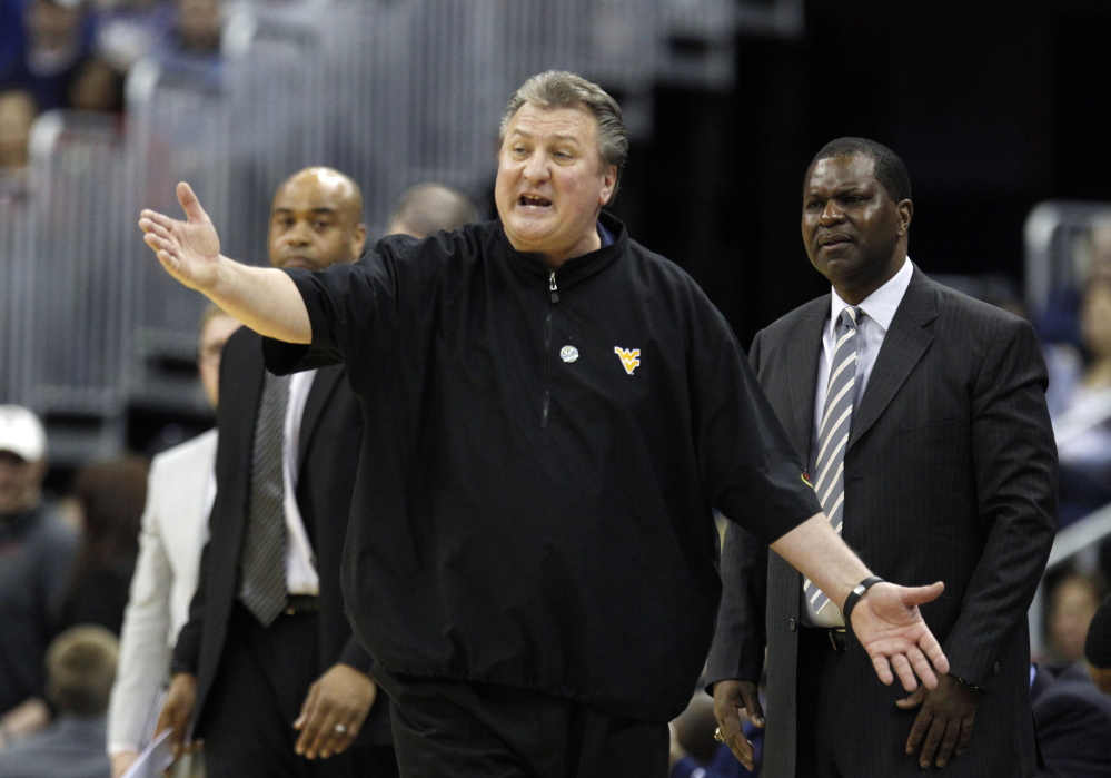 West Virginia Coach Bob Huggins says his team will be up to the challenge for Thursday night’s Sweet 16 game against unbeaten Kentucky, the NCAA tourney’s top overall seed.