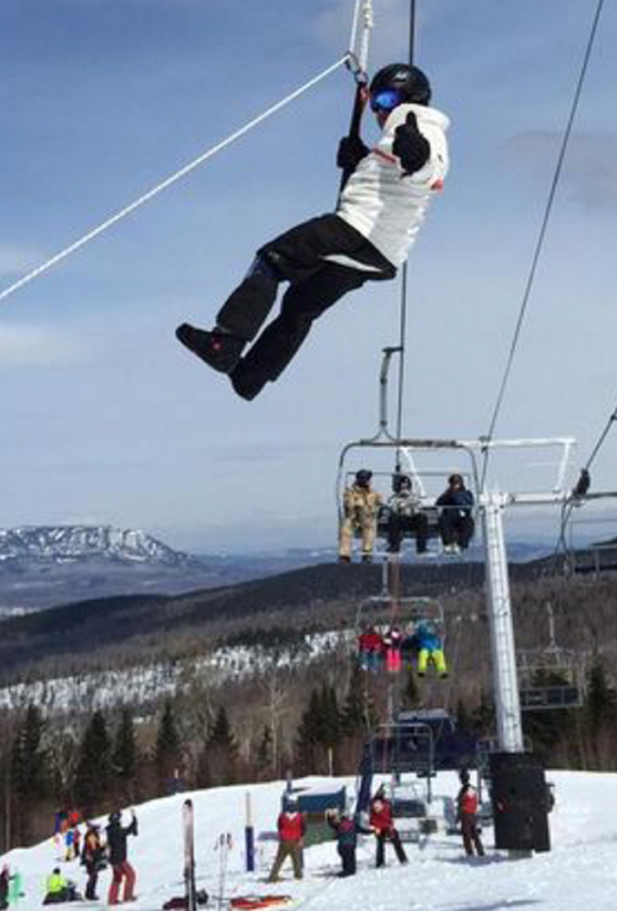 Hank Margolis of Marlborough, Mass. is lowered from a chairlift at Sugarloaf after a mechanical failure Saturday. Investigators found a brake flaw that affected six other lifts there.
