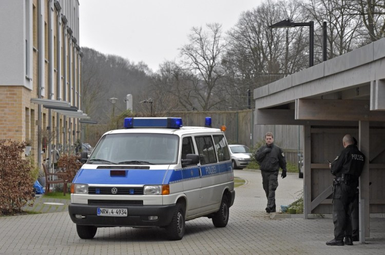 Police officers block a street where the co-pilot of the crashed Germanwings airliner reportedly lived in Duesseldorf, Germany. The co-pilot barricaded himself in the cockpit and “intentionally” sent the plane full speed into a mountain in the French Alps, ignoring the pilot’s frantic pounding on the door and the screams from passengers, a prosecutor said Thursday.