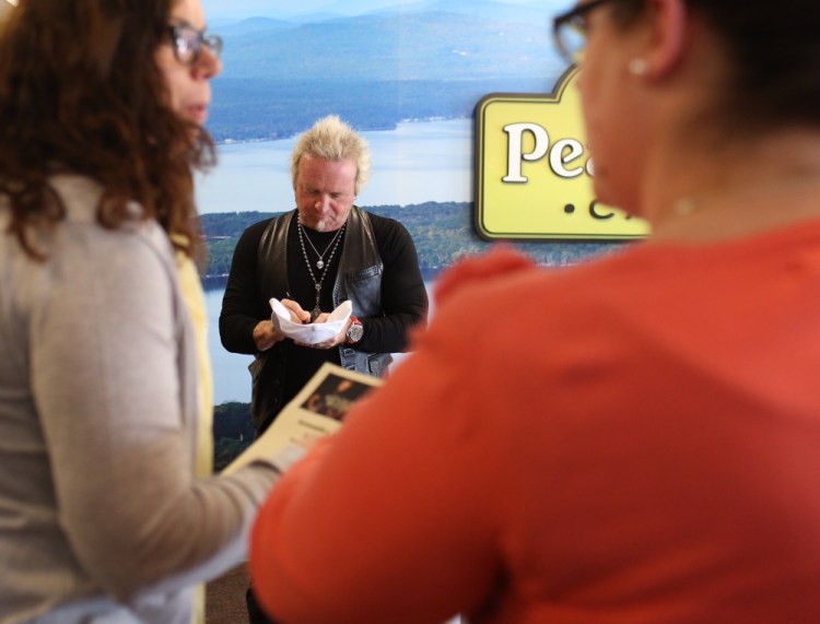 Joey Kramer signs autographs at St. Joseph’s College of Maine in Standish on Thursday. The Aerosmith drummer was there to promote his organic coffee brand.