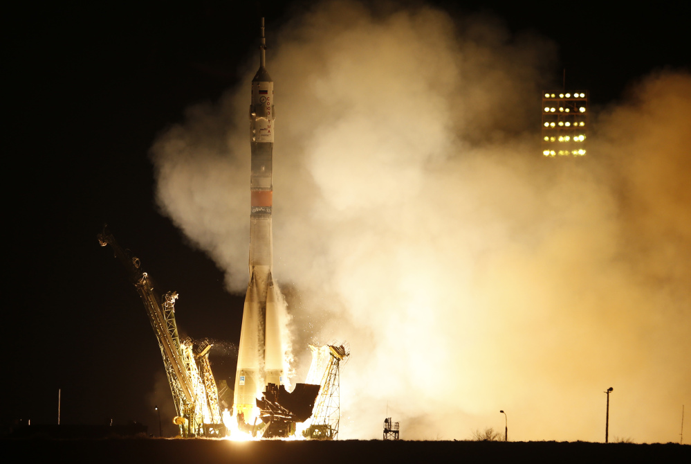 The Soyuz-FG rocket booster with Soyuz TMA-16M spaceship blasts off at the Russian-leased Baikonur cosmodrome in Kazakhstan early Saturday. The Russian rocket carried U.S. astronaut Scott Kelly, and Russian cosmonauts Gennady Padalka and Mikhail Kornienko to the International Space Station.