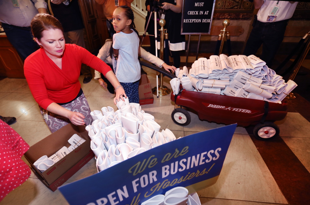 Five-year-old Patience, daughter of Angie and Cynthia Alexander (not shown), was recruited by Freedom Indiana to deliver wagons of protest letters to some lawmakers.