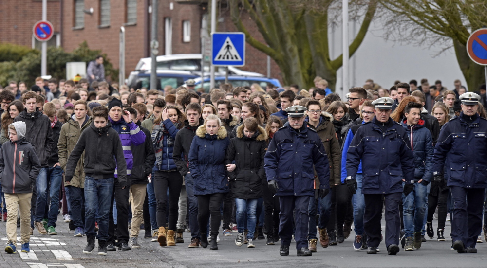 Students arrive for a memorial service Friday in Haltern, Germany. Sixteen students and two teachers from Haltern were among the 150 victims of a Germanwings plane crash in the French Alps on Tuesday.  
The Associated Press