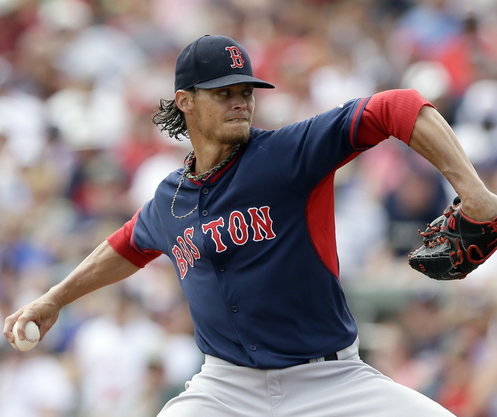 Clay Buchholz, lined up to pitch Boston’s season opener, gave up 12 hits and four runs in five-plus innings Friday in a 4-2 loss to the Braves in Kissimmee, Fla.