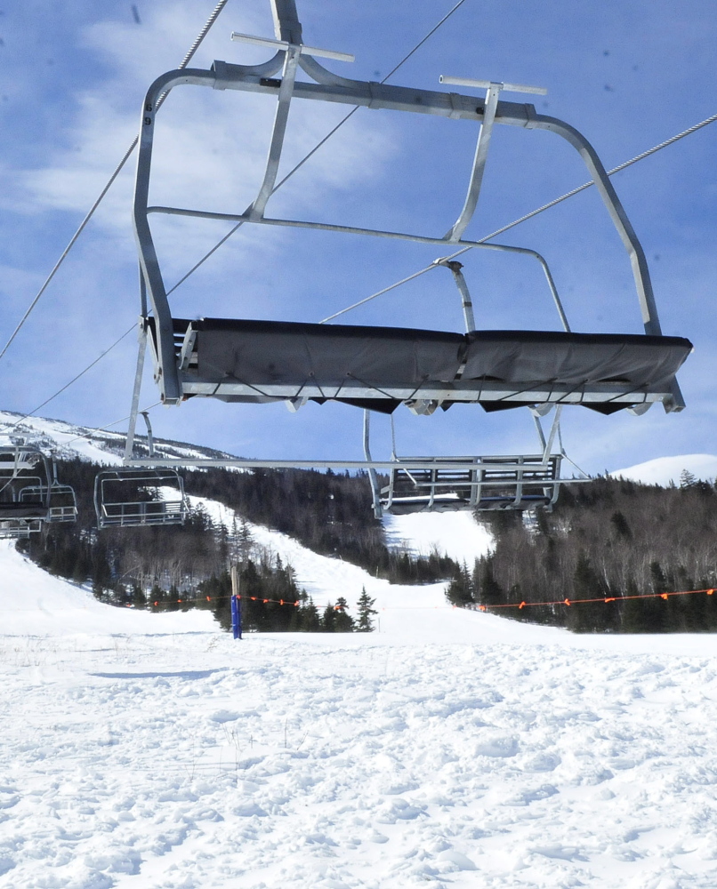 Chairs hang in the air at the base of the unused King Pine chairlift this week at the Sugarloaf ski resort. A malfunction of the lift, installed in 1988, had caused the lift to travel backward, injuring seven skiers.