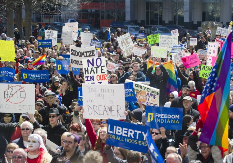 Thousands of opponents gather Saturday outside the Indiana State House to rally against Gov. Mike Pence and new legislation they consider discriminatory against gays and lesbians.