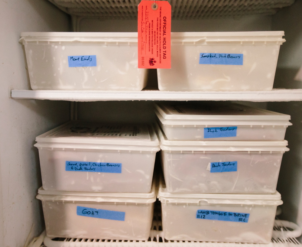 “Embargoed” by city health inspectors, about 80 pounds of meat – specially processed duck, beef, chicken and pork – sit in a freezer at Duckfat in Portland.