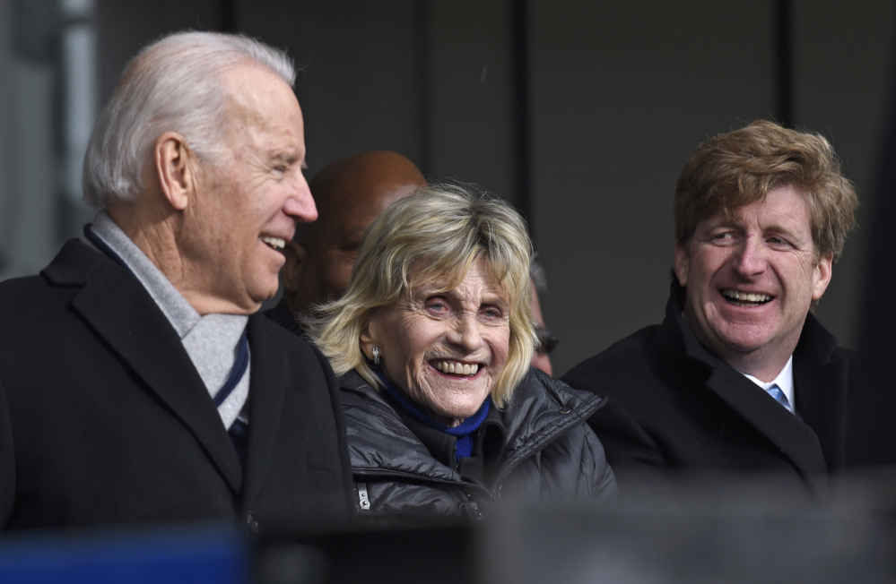 Jean Kennedy, center, flanked by Vice President Joe Biden, left, and former Rhode Island Rep. Patrick Kennedy, listens during the dedication of the Edward M. Kennedy Institute for the United States Senate on Monday in Boston.