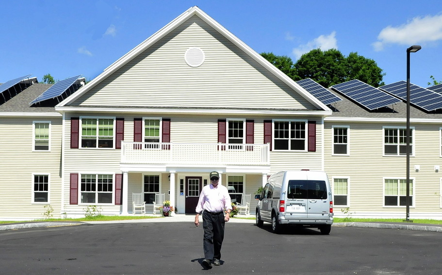 Resident Alan Sawyer Sr. walks out of Brookside Village, a low-income senior housing project in Farmington. Over 9,000 Maine seniors are on a waiting list for affordable, subsidized homes, and their ranks are growing.
