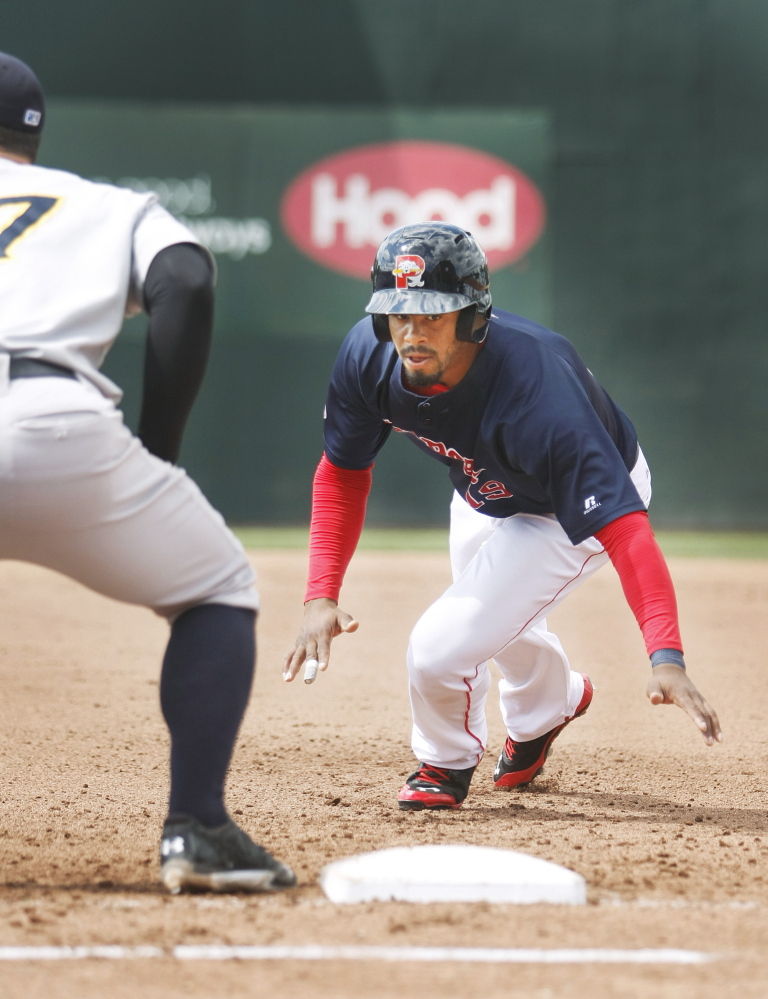 Portland Sea Dogs' Henry Ramos dives back to first base safely during a game against the Trenton Thunder at Hadlock Field in May. Press Herald file photo