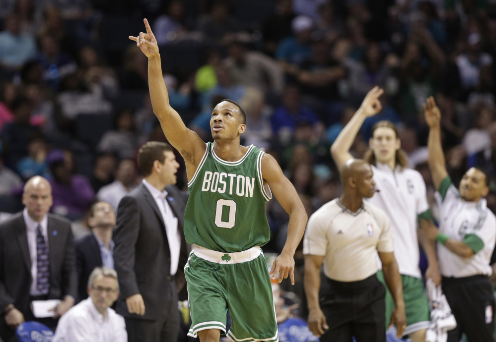 The Celtics’ Avery Bradley celebrates after making a three-point basket in the second half Monday night against the Charlotte Hornets. The Celtics won, 116-104, with Bradley leading the team with 30 points.