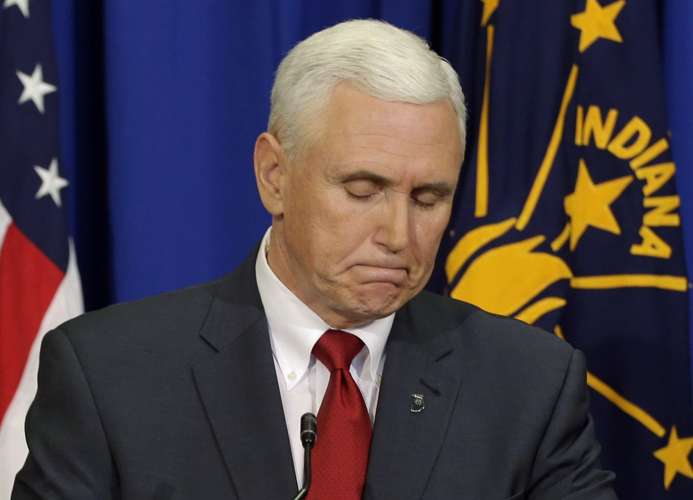 Indiana Gov. Mike Pence listens to a question during a news conference Tuesday in Indianapolis about his state's new religious-objections law.