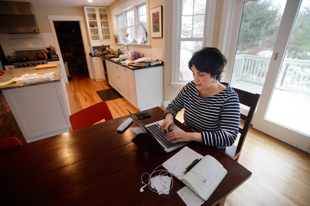 Sara Juli works from her home in Falmouth on Thursday. She and her family moved to Maine from New York last summer. She said they appreciate the space they have while she and her husband maintain their New York careers.