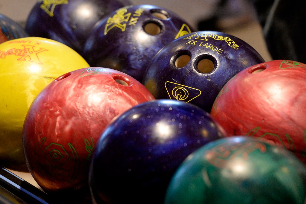 Bowling balls ready to roll at Bayside Bowl in Portland.
