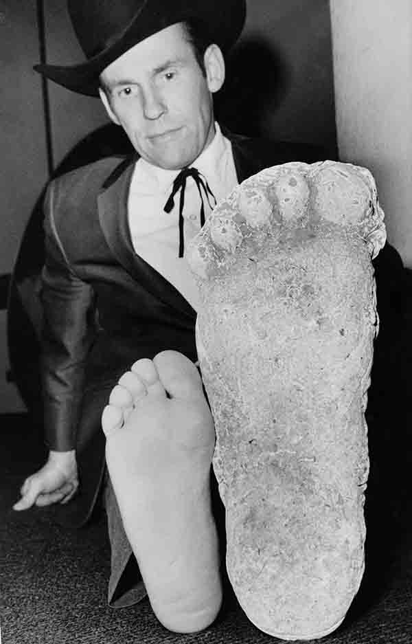 Roger Patterson compares his foot with a cast in Los Angeles on Nov. 3, 1967, that he says he made of California?s Legendary Bigfoot after tracking it in forest country near Eureka, Calif. Patterson says he spotted the hairy, 7-foot-tall creature, and made motion pictures of it from a distance. At the time he said he planned to subdue the beast with tranquilizer guns the next time he located it. The Associated Press