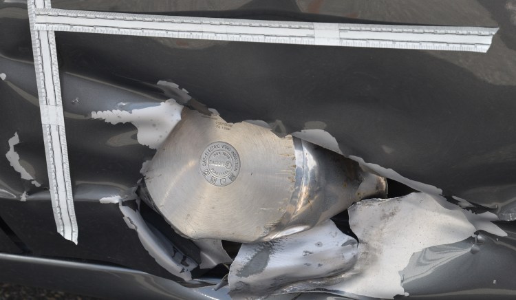 This undated forensics photograph was  presented as evidence during the federal death penalty trial of Dzhokhar Tsarnaev on March 19, 2015, shows a portion of a pressure cooker that was used as part of an explosive device, which pierced the door panel of a sedan parked in Watertown, Mass. An FBI agent has testified that Tsarnaev had a variety of extremist materials on his computer, including an issue of the al-Qaida magazine Inspire with an article entitled "Make a Bomb in the Kitchen of Your Mom." The Associated Press / U.S. Attorney's Office