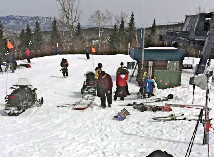 First aid is administered to injured skiers at Sugarloaf Mountain Resort after a chairlift accident Saturday. The Associated Press/Greg Hoffmeister 