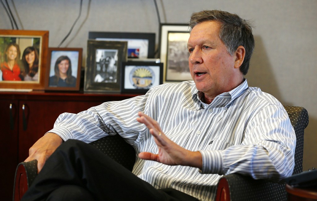 Ohio Gov. John Kasich answers questions during a recent interview in his office. He sees himself as an advocate for the poor, defends Common Core education standards, supported Ohio's Medicaid expansion as part of Obama's health care law, and won't rule out a pathway to citizenship for immigrants in the country illegally as part of an immigration overhaul. The Associated Press
