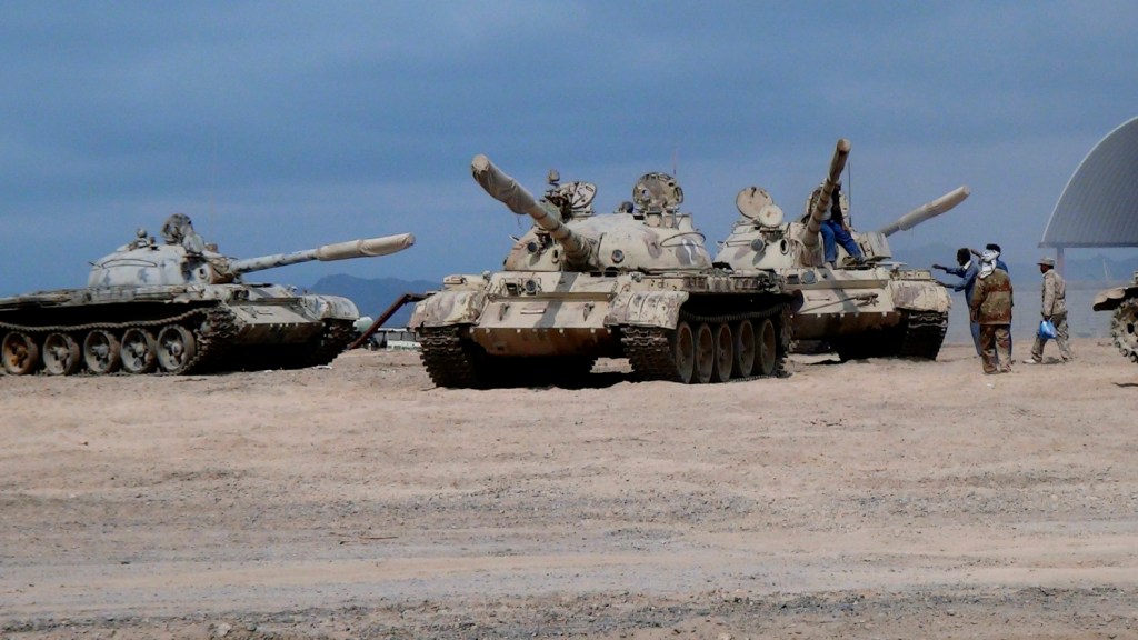 In this photo taken Tuesday, tanks seized by militiamen loyal to Yemen's President Abed Rabbo Mansour Hadi take positions at the al-Anad air base in the southern province of Lahej, 35 miles north of Aden, Yemen. Hadi fled the country by sea Wednesday. Hours later, Saudi Arabia announced that it had begun airstrikes against the Houthi rebels.