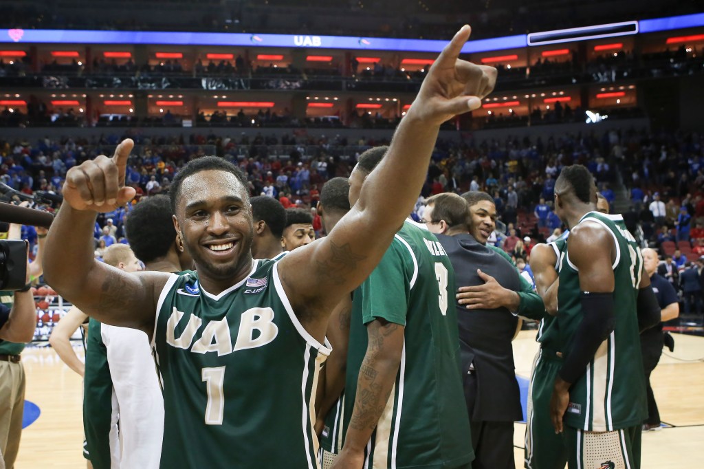 UAB guard Denzell Watts acknowledges the fans as he and his teammates celebrate their 60-59 win over third-seeded Iowa State in an NCAA second-round game at Louisville, Ky. The Associated Press