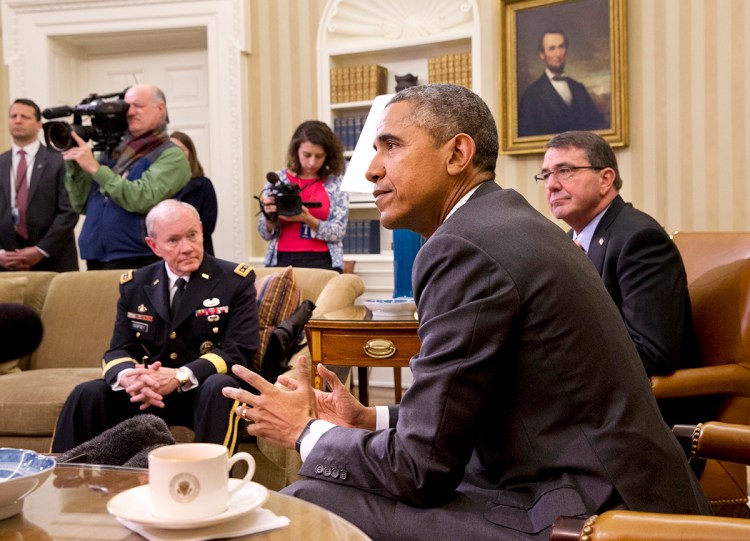 President Barack Obama, accompanied by Defense Secretary Ash Carter, right, and Joint Chiefs Chairman Gen. Martin Dempsey, speaks about Iran and Israeli Prime Minister Benjamin Netanyahu's speech to Congress, Tuesday,  in the Oval Office. The president said Netanyahu didn't offer any "viable alternatives" to the nuclear negotiations with Iran during his speech to Congress. The Associated Press
