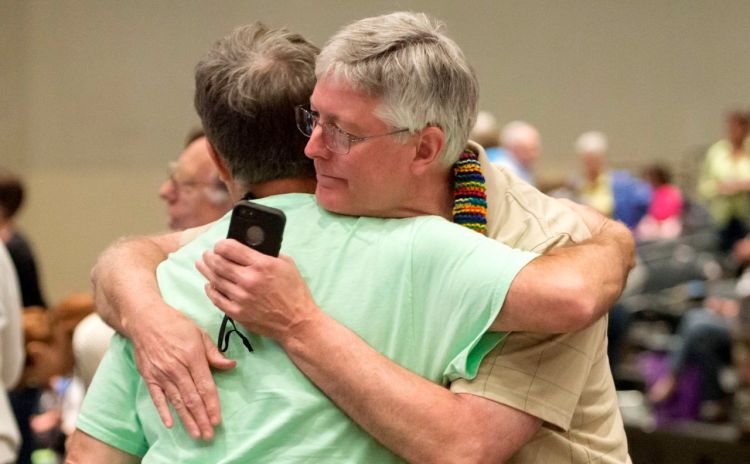 Gary Lyon, left, of Leechburg, Pa., and Bill Samford, of Hawley, Pa., celebrate after a vote allowing Presbyterian pastors discretion in marrying same-sex couples at the 221st General Assembly of the Presbyterian Church in Detroit in this June 19, 2014, photo, The Presbyterian Church (U.S.A.) has now approved redefining marriage in the church constitution to include a "commitment between two people," becoming the largest Protestant group to formally recognize gay marriage as Christian and allow same-sex weddings in every congregation. The Associated Press