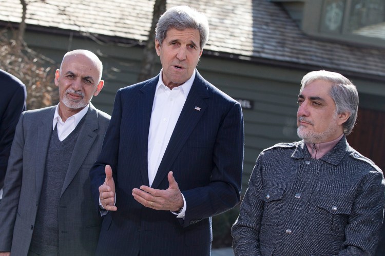 Secretary of State John Kerry speaks before the start of a day of meetings with Afghanistan's President Ashraf Ghani, left, and Afghanistan's Chief Executive Abdullah Abdullah at the Camp David presidential retreat, Monday. The Associated Press