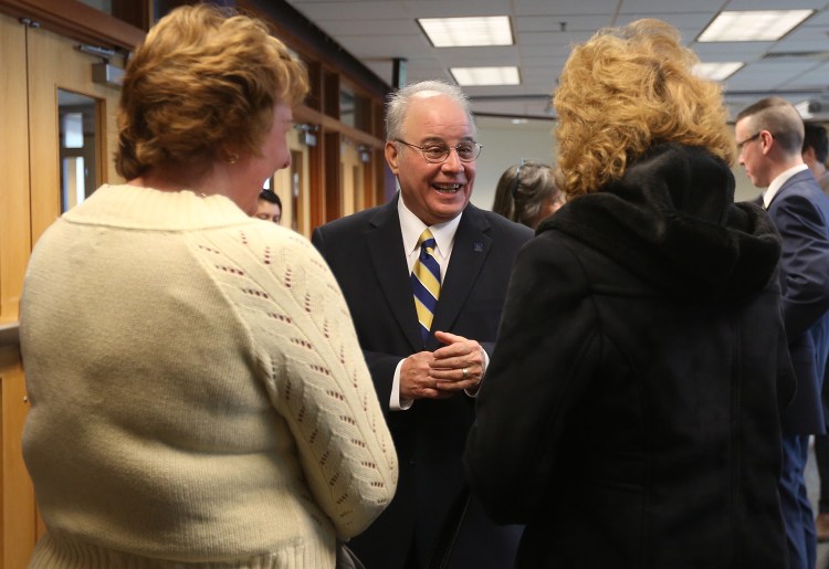 Newly appointed USM president Harvey Kesselman greets attendees of his induction press conference at the Glickman Library at USM in Portland Wednesday. Whitney Hayward/Staff Photographer