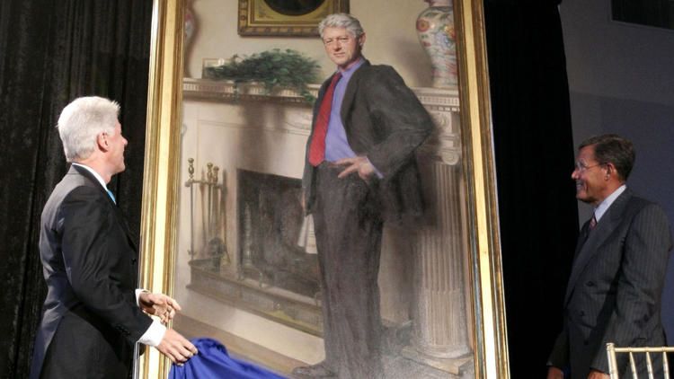 Former President Bill Clinton and Lawrence M. Small, secretary of the Smithsonian Institution, look at Clinton's portrait after its unveiling at the Smithsonian Castle Building in Washington in this April, 24, 2006, photo. The artists says a shadow beside Clinton is a reference to Lewinsky dress and symbolic of the shadow cast on his presidency. The Associated Press