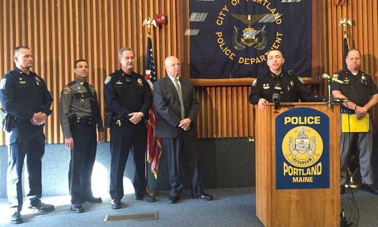 Portland Police Chief Michael Sauschuck, at the podium during a news conference Wednesday, said that a legislative effort to repeal the requirement for a concealed weapons permit would endanger the public. WIth him, from left, are Gorham's interim Police Chief Christopher Sanborn; Scarborough Capt. David Grover; Yarmouth Lt. Dean Perry; and South Portland Chief Ed Googins. At right is Cumberland County Sheriff Kevin Joyce.