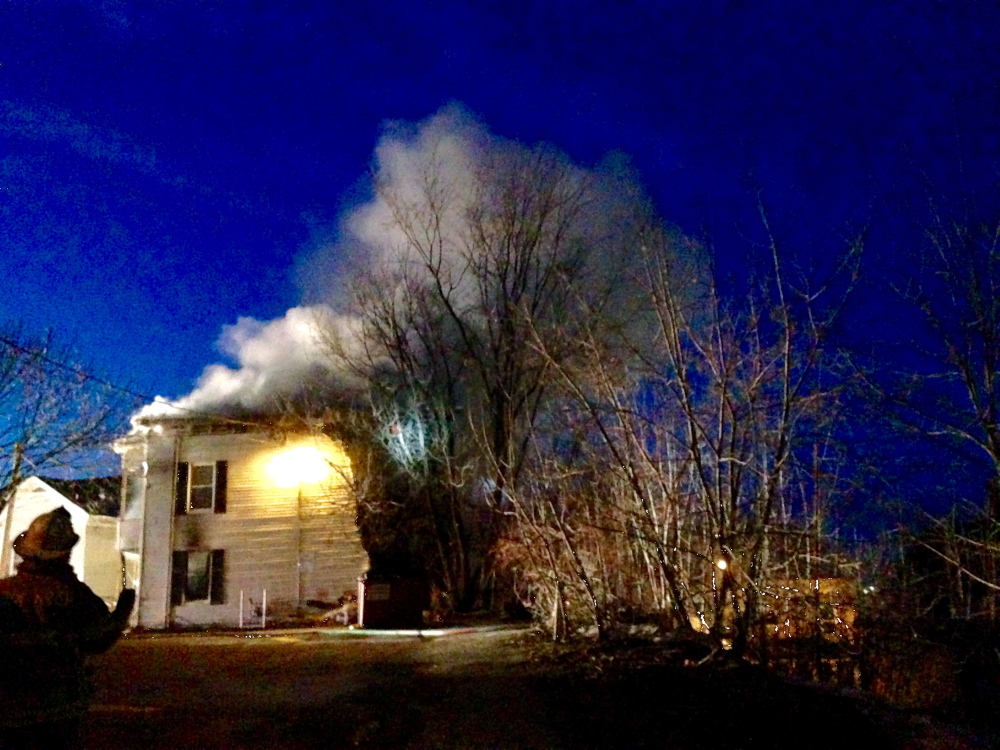 A multi-unit apartment house at 15 State St. burns Friday night in Augusta. Departments from several surrounding communities helped put out the fire, which was reported shortly before 7:30 p.m.