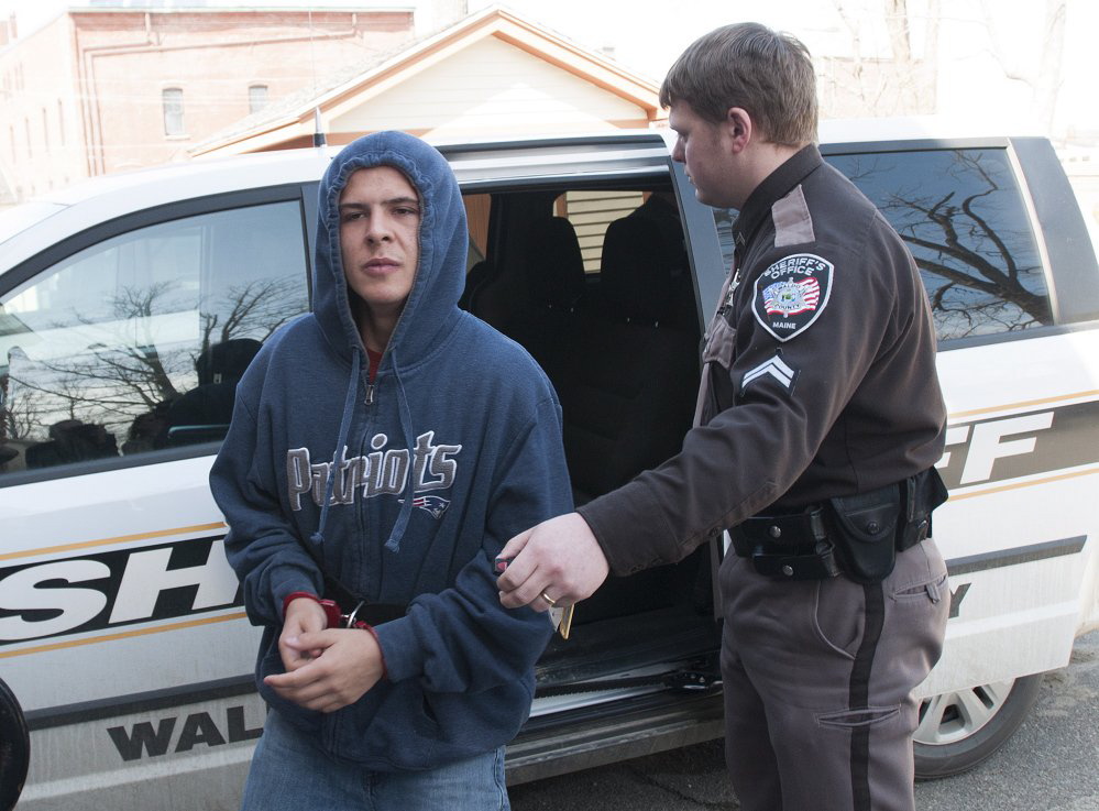 Colby Hodgdon, 16, is led to Waldo County District Court in Belfast on April 3. He is accused of killing his father, Steven Hodgdon, in Troy in March.