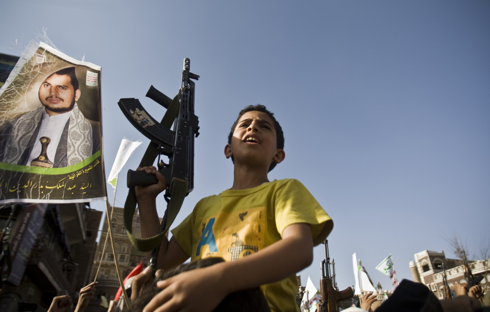 A boy holds a weapon Wednesday in Sanaa, Yemen, at a rally protesting Saudi-led airstrikes.
The Associated Press