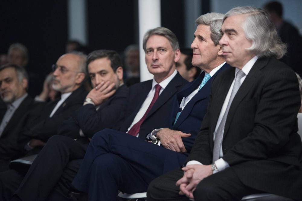 British Foreign Secretary Philip Hammond, center, U.S. Secretary of State John Kerry, center right, and U.S. Secretary of Energy Ernest Moniz listen while Iranian Foreign Minister Javad Zarif makes a statement at the Swiss Federal Institute of Technology in Lausanne, Switzerland, on Thursday.