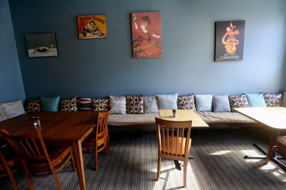 The dining room is a hodge-podge of mismatched tables and eclectic art.