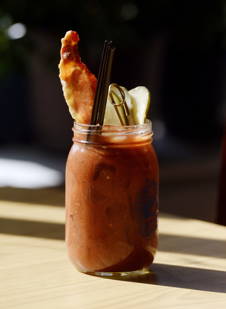 A bloody Mary with bacon and pickle.