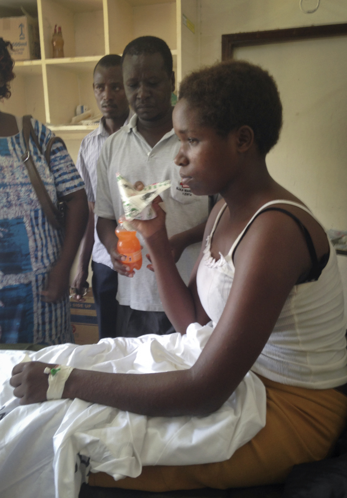 Cynthia Cheroitich, 19, a survivor of the killings at Garissa University College who was found Saturday, two days after the attack, drinks some milk in a hospital ward in Garissa.