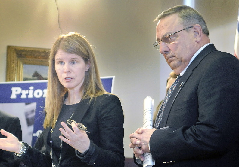 DHHS Commissioner Mary Mayhew, with Gov. Paul LePage at her side, discusses his welfare reform ideas, including requiring Temporary Assistance for Needy Families applicants to apply for three jobs before getting benefits, and tougher penalties for abusing the system.