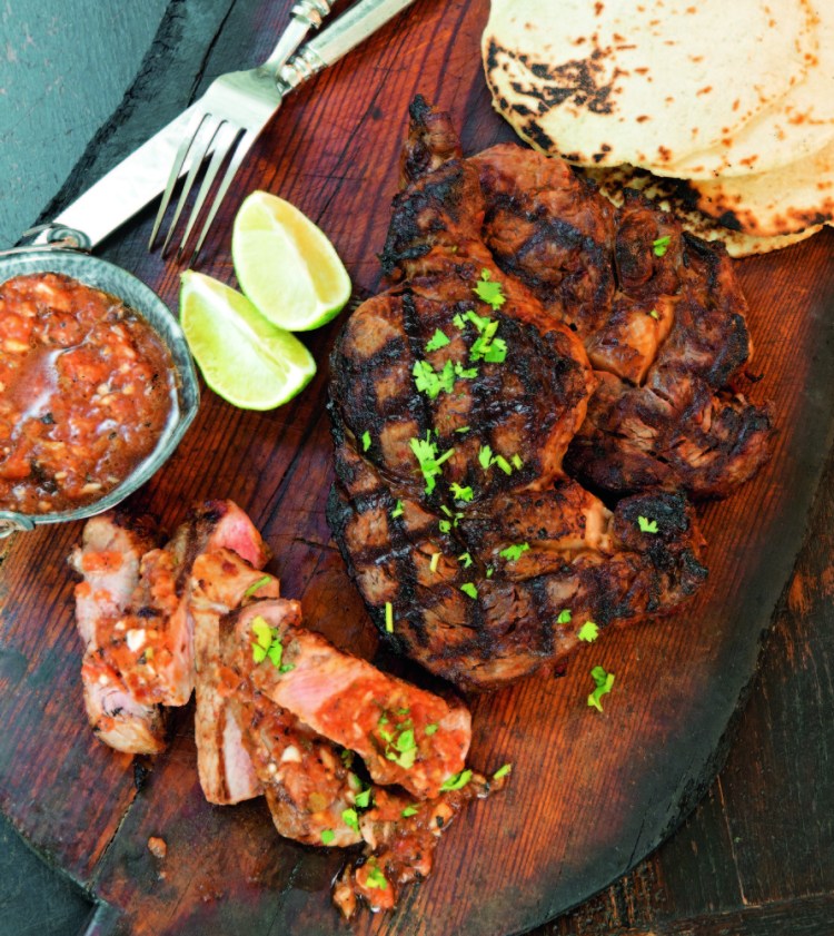 Shannon Bard’s red chile-marinated rib eye steaks, one of more than 100 recipes in “The Gourmet Mexican Kitchen.”