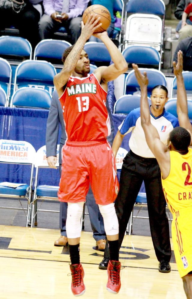 Rachel Von | The Journal Gazette 
 Red Claws' James Young, left, throws the ball while Mad Ants' Jordan Crawford tries to block him during the Mad Ants vs. Red Claws NBA D-League playoff game at the Memorial Coliseum in Fort Wayne, IN on Tuesday.