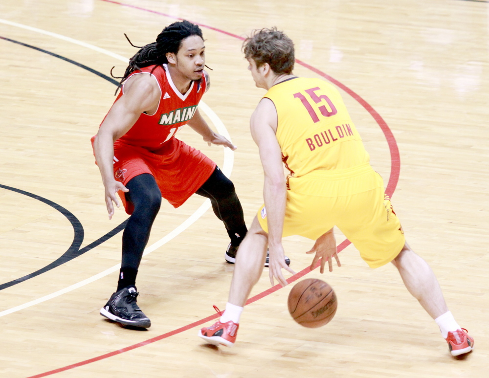 Sherwood Brown of the Maine Red Claws, left, attempts to hold his position against Matt Bouldin of the Fort Wayne Mad Ants during Fort Wayne’s playoff victory Tuesday night. The two teams meet again Saturday in Game 2 of their best-of-three first-round series.